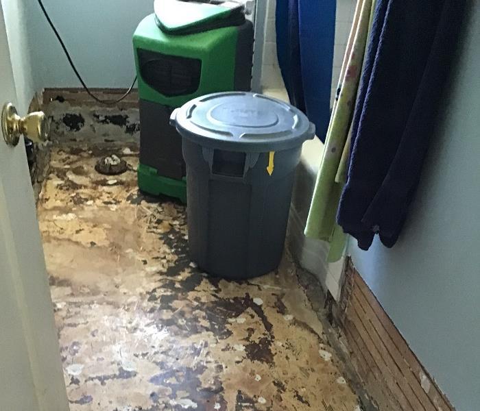 Flooring ripped out of bathroom due to water damage