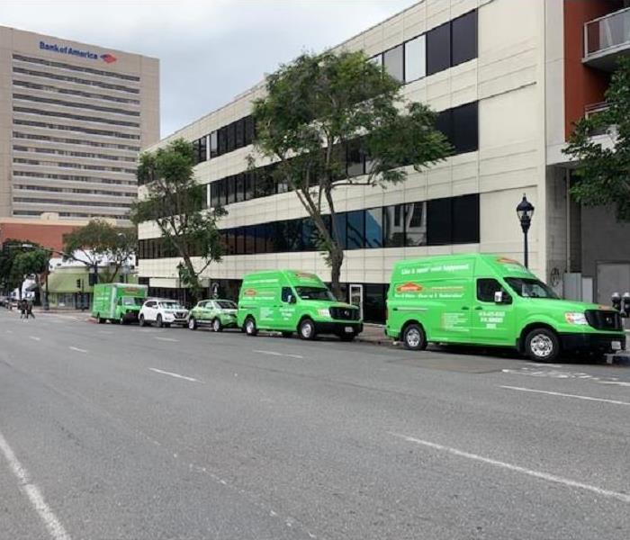 SERVPRO vehicles outside of commercial building 